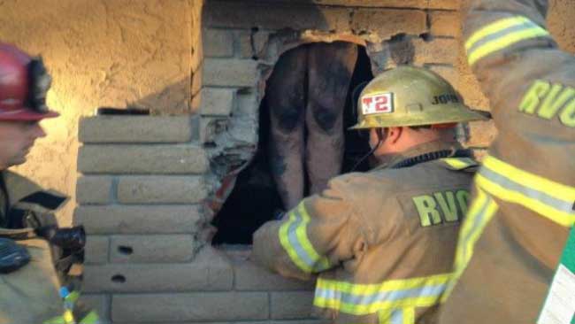 Woman Stuck In Chimney Photo Crews Rescue Naked Woman Trapped In Ex