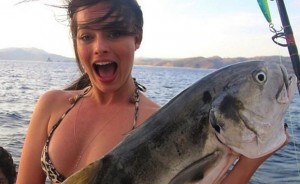 Margot Robbie holding a giant fish
