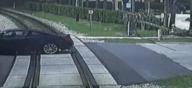 Woman narrowly escapes car as train approaches