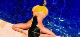 Kim Kardashian Shares Topless Poolside Pic