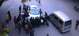 Car Lifted, Woman Saved In China : Watch how this woman escapes unhurt despite getting run over by a car