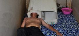 Man gets head stuck in washing machine (Photo)